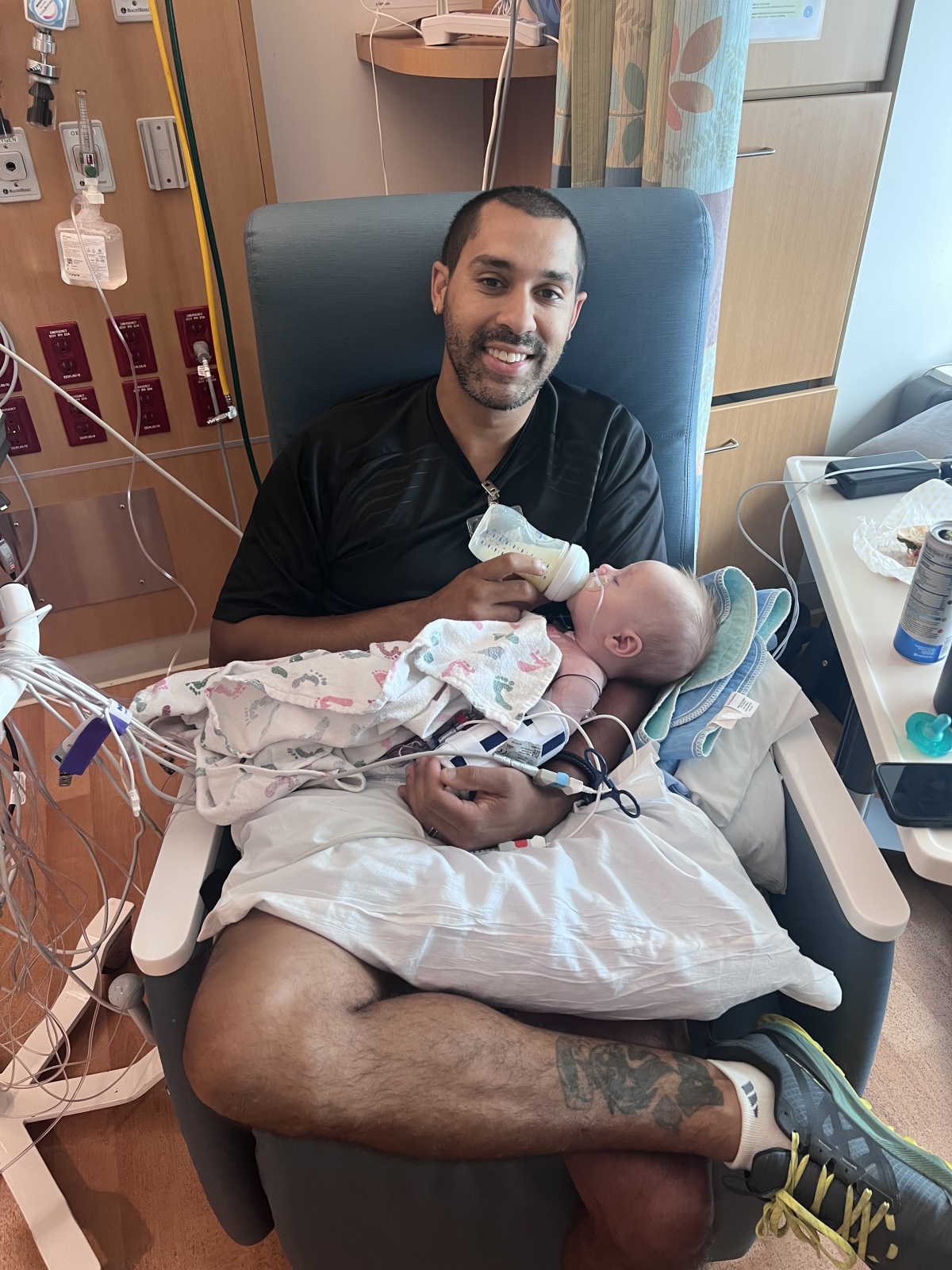 Daddy's first time holding and feeding Elijah post surgery
