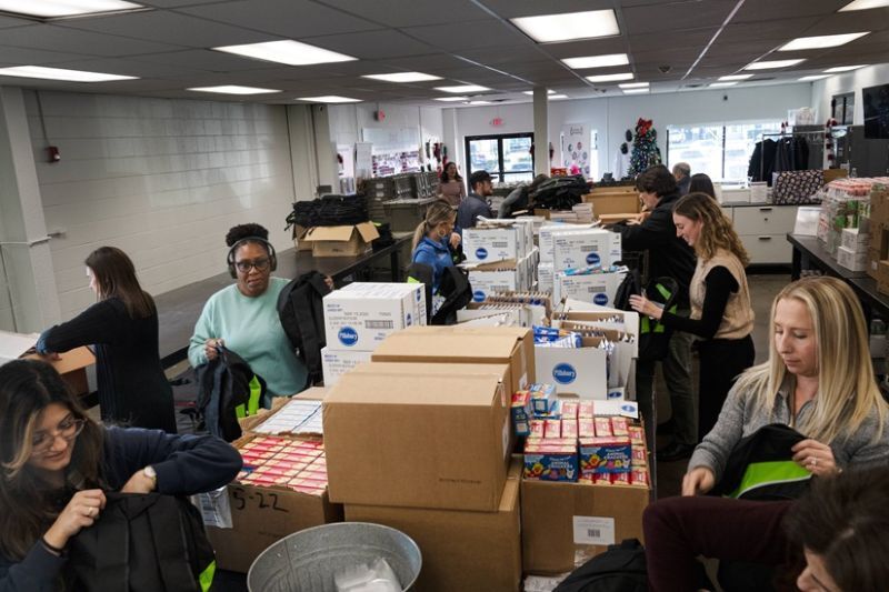 Packing meal bags with my firm, SGT, a longtime sponsor of Filling in the Blanks