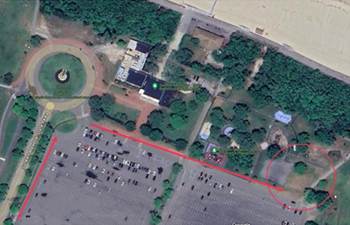 Aerial view of a park with parking lot and trees

AI-generated content may be incorrect.