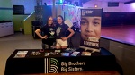 Destiny & Alisha manning a table at the roller rink
