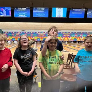 Friends having fun bowling.