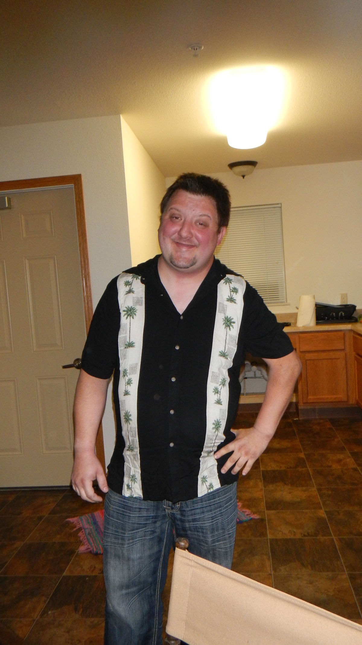 wearing a t-shirt I got him for Christmas, one year