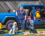 Gilly, white dog in front with her Training Team