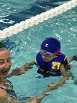 Learning to swim at camp.