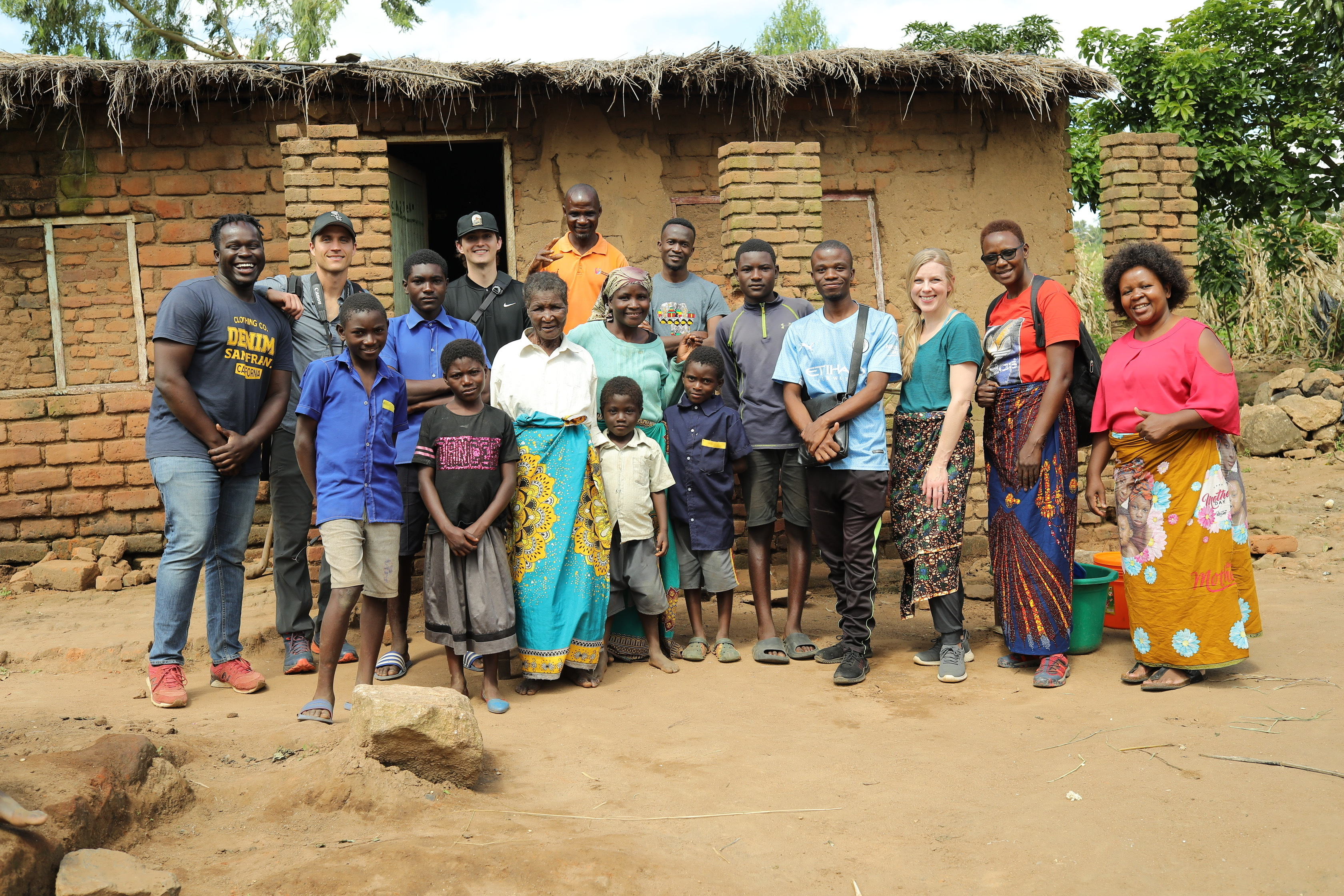 Eliza with her family and the amazing Malawi staff.