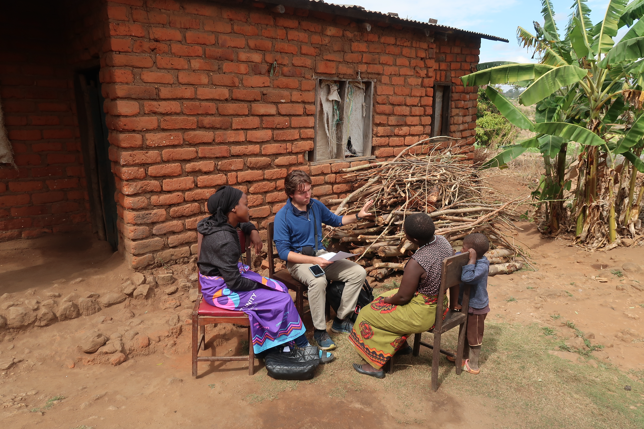 Talking with Mallta outside of her home in Blantyre