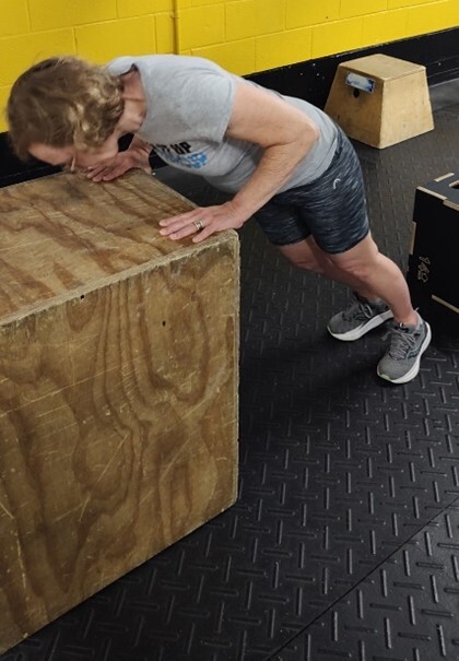 Colleen practicing her box push-ups.