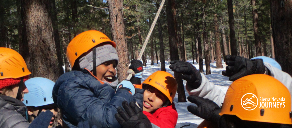 On the low ropes course at Camp student push their limits and build trust.
