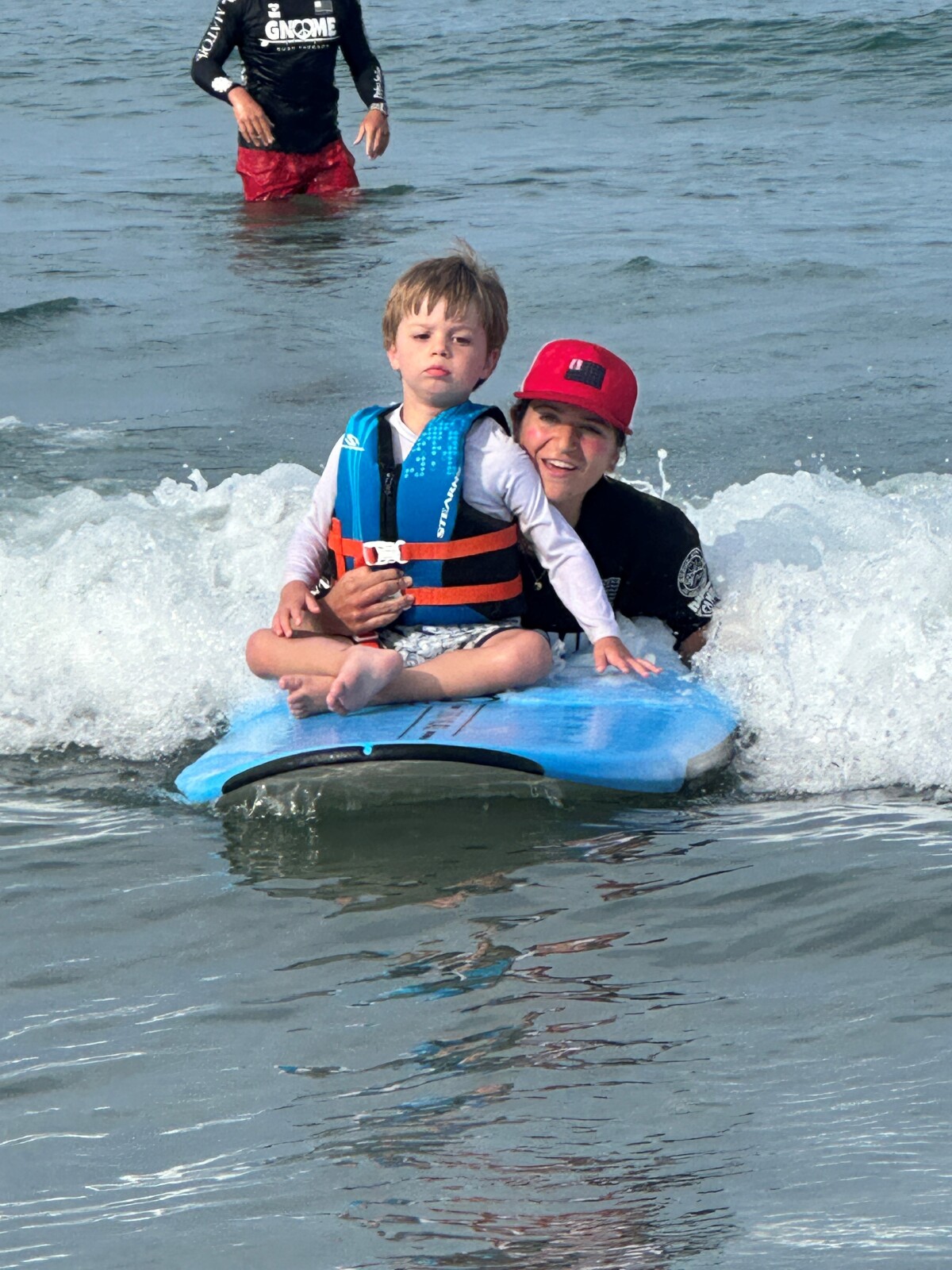 Harry catching some waves with Gnome Surf at Nantasket Beach