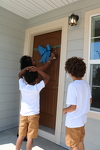 Karmen and her family at their home dedication