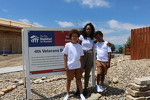 Karmen and her family at their home dedication