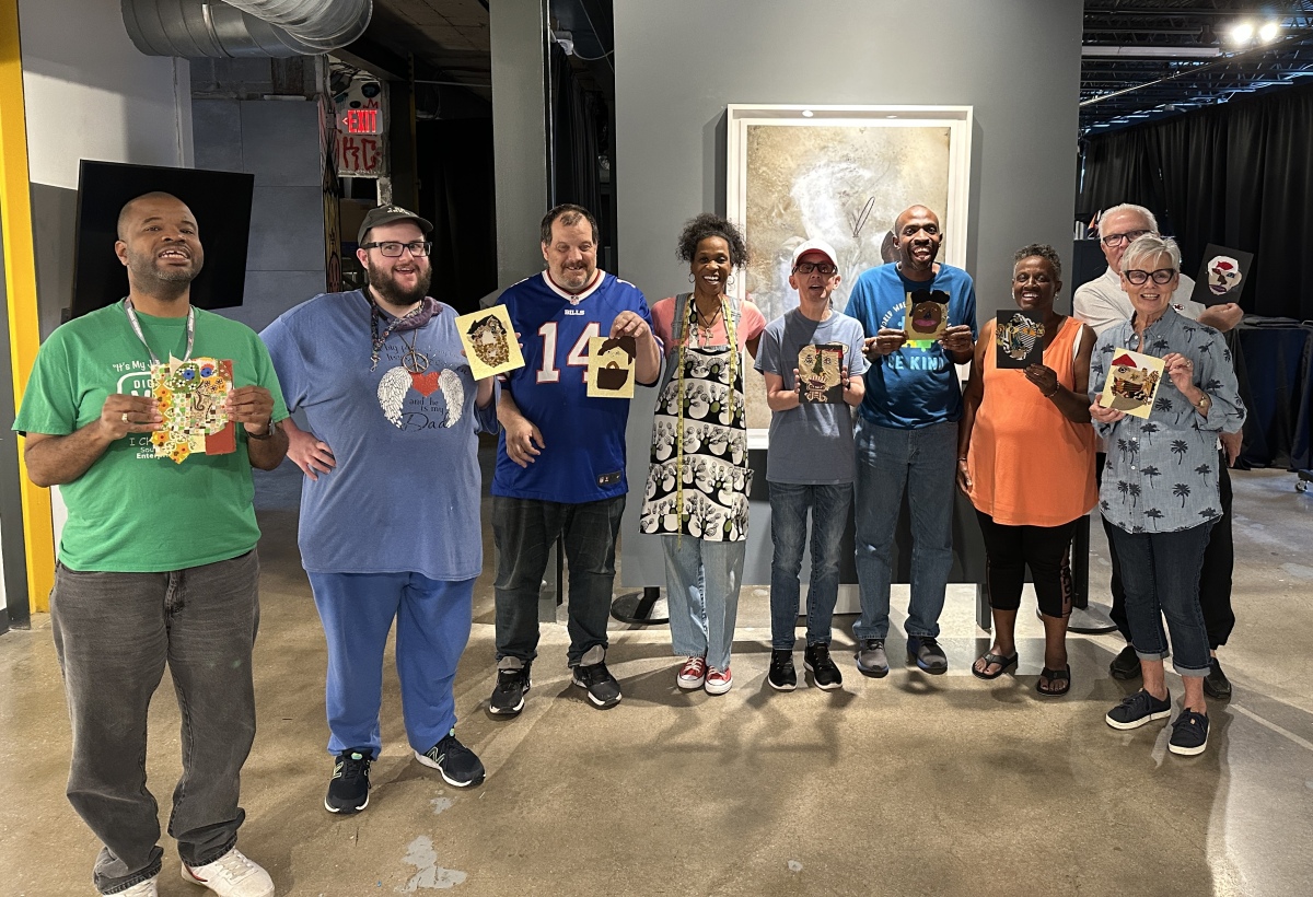 Resident Artist, Karen E. Griffin, teaching a workshop with a group from Southeast Enterprises