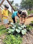 Zuey & Adriel (siblings) gardening with Joe