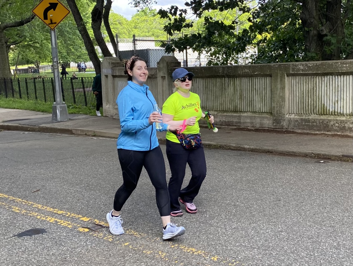 Guiding during an Achilles workout in Forest Park with a visually impaired athlete