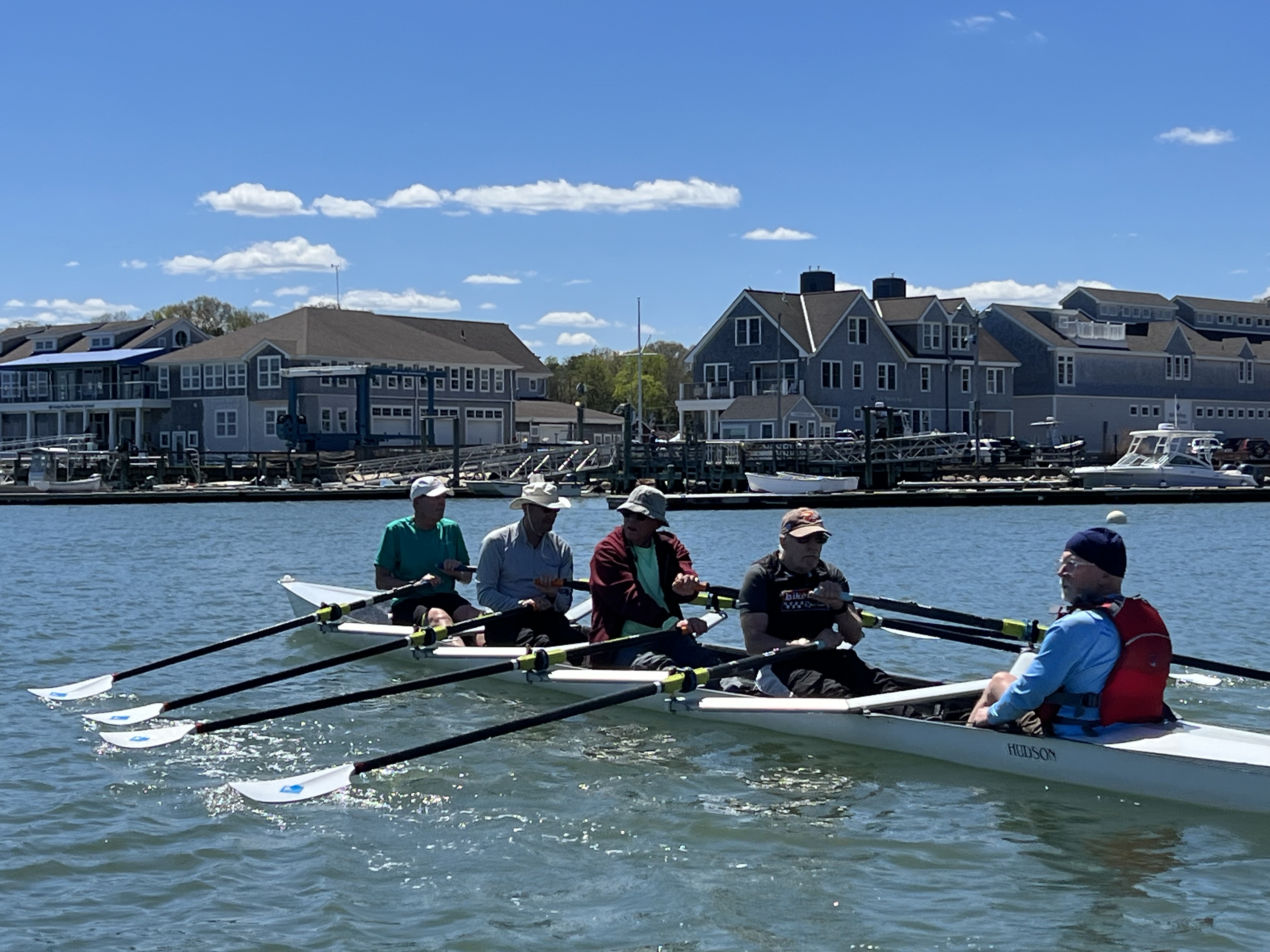 Volunteer coach, Bob Mills, steers this Veterans crew home to DBMS