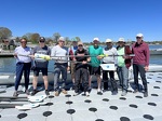 Veterans team poses after a Saturday morning row on the Bay