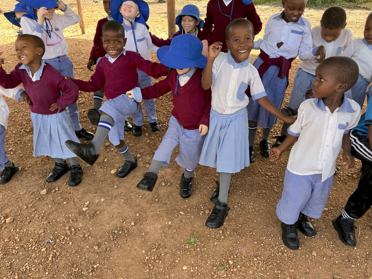 Students celebrating after getting their new shoes!