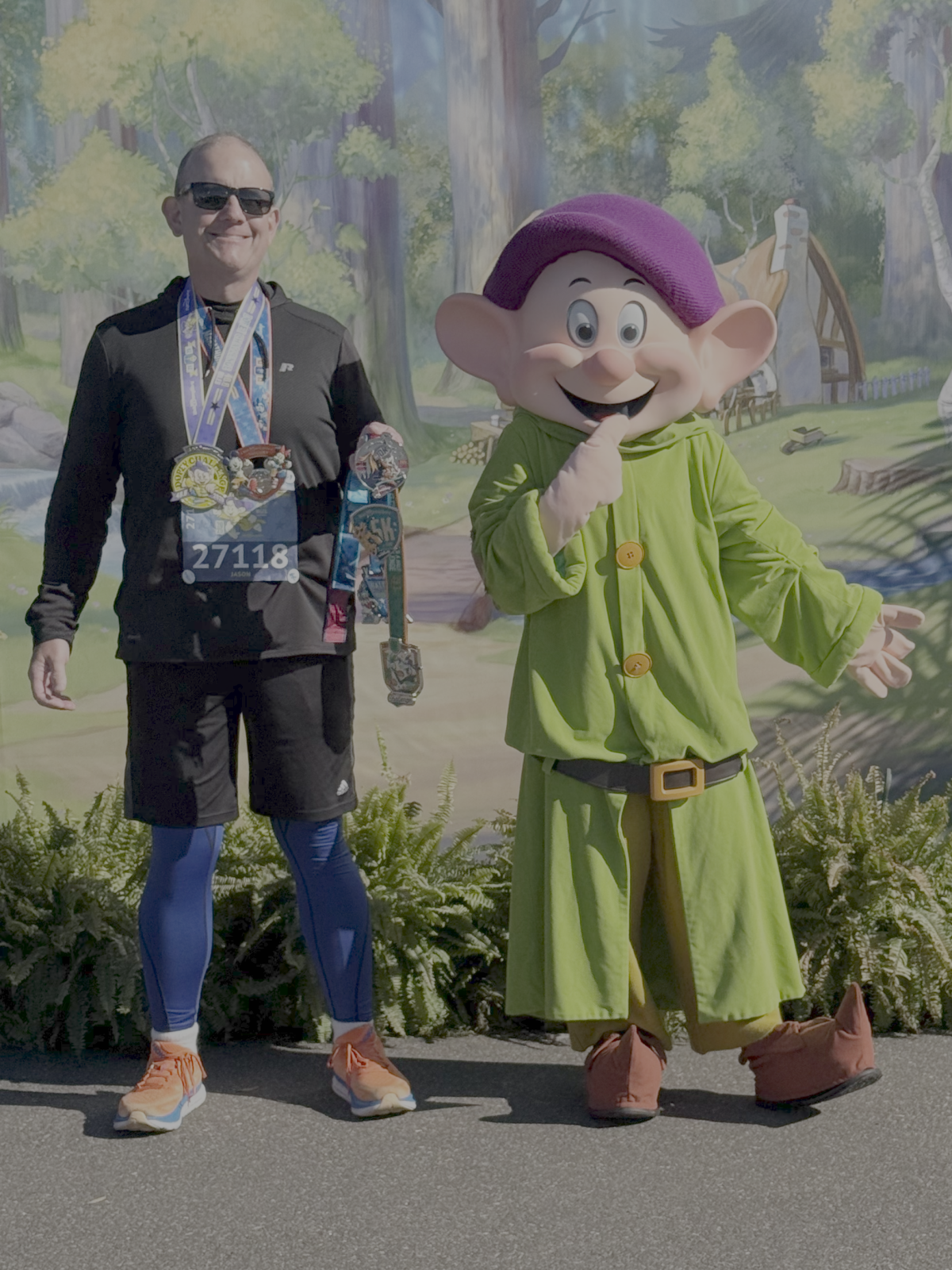 Celebrating with Dopey himself at the end of the 2025 Walt Disney World Marathon!