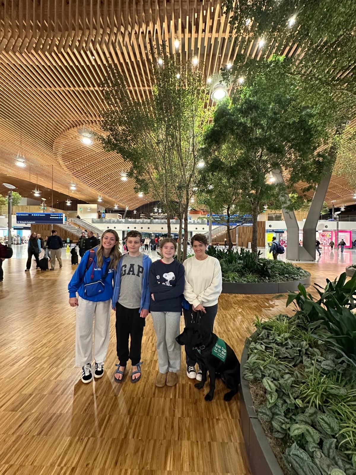 My cute family picking me up from the airport with our guide dog in training that we raised named Kazoo!