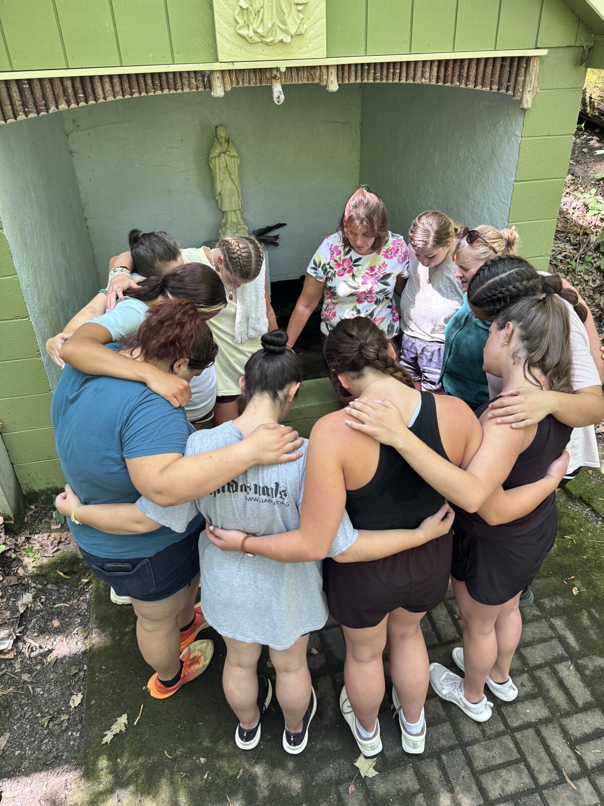 Praying at St Kateri Tekakwithas Baptismal Site