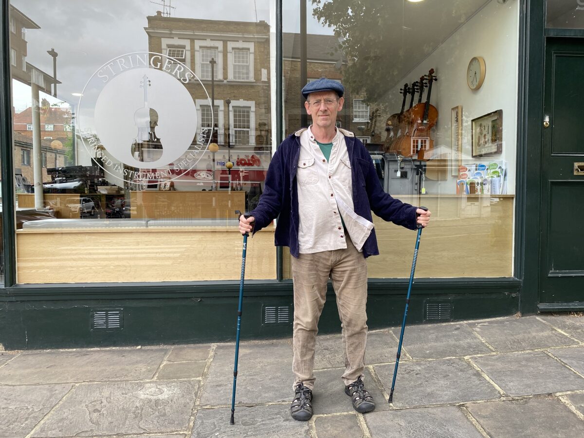 Training with trekking Poles outside Music Shop.
