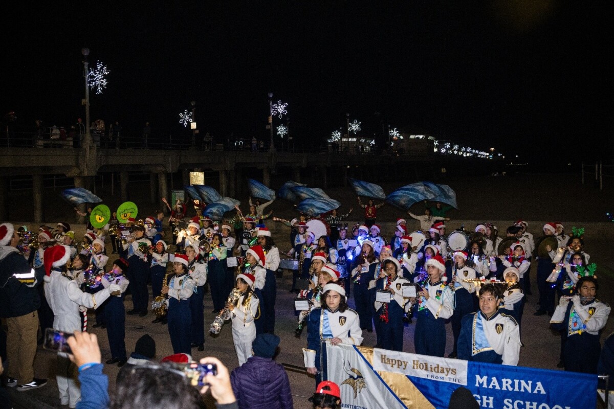The Marina High School Marching Band brings holiday cheer to the community with performances of beloved seasonal classics.