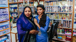 Manju with her daughter, jewelry shop owner and beautician, India