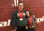 Alison and Josie rocking their swimming medals