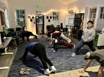 Students doing Yoga with Morgan, Maria, & Dan