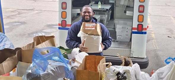 Mail carrier heroes with Stamp Out Hunger
