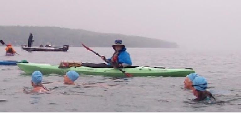 Escorting some blue-capped Swimmin' Women